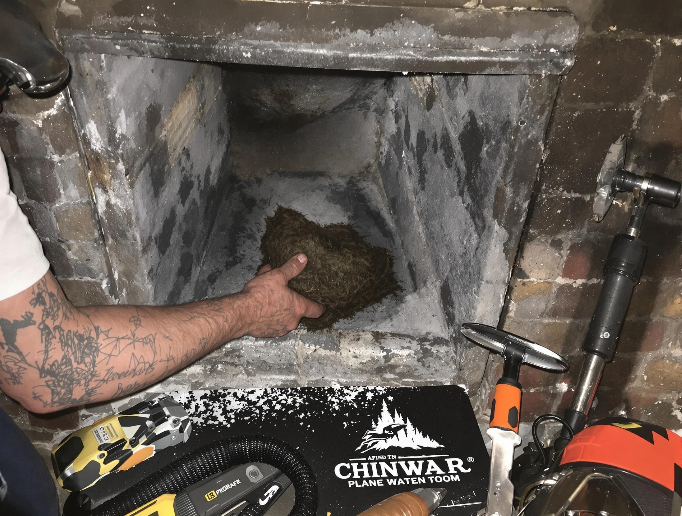 Woonsocket Chimney Sweep safely removing debris and screening chimney in Woonsocket, RI