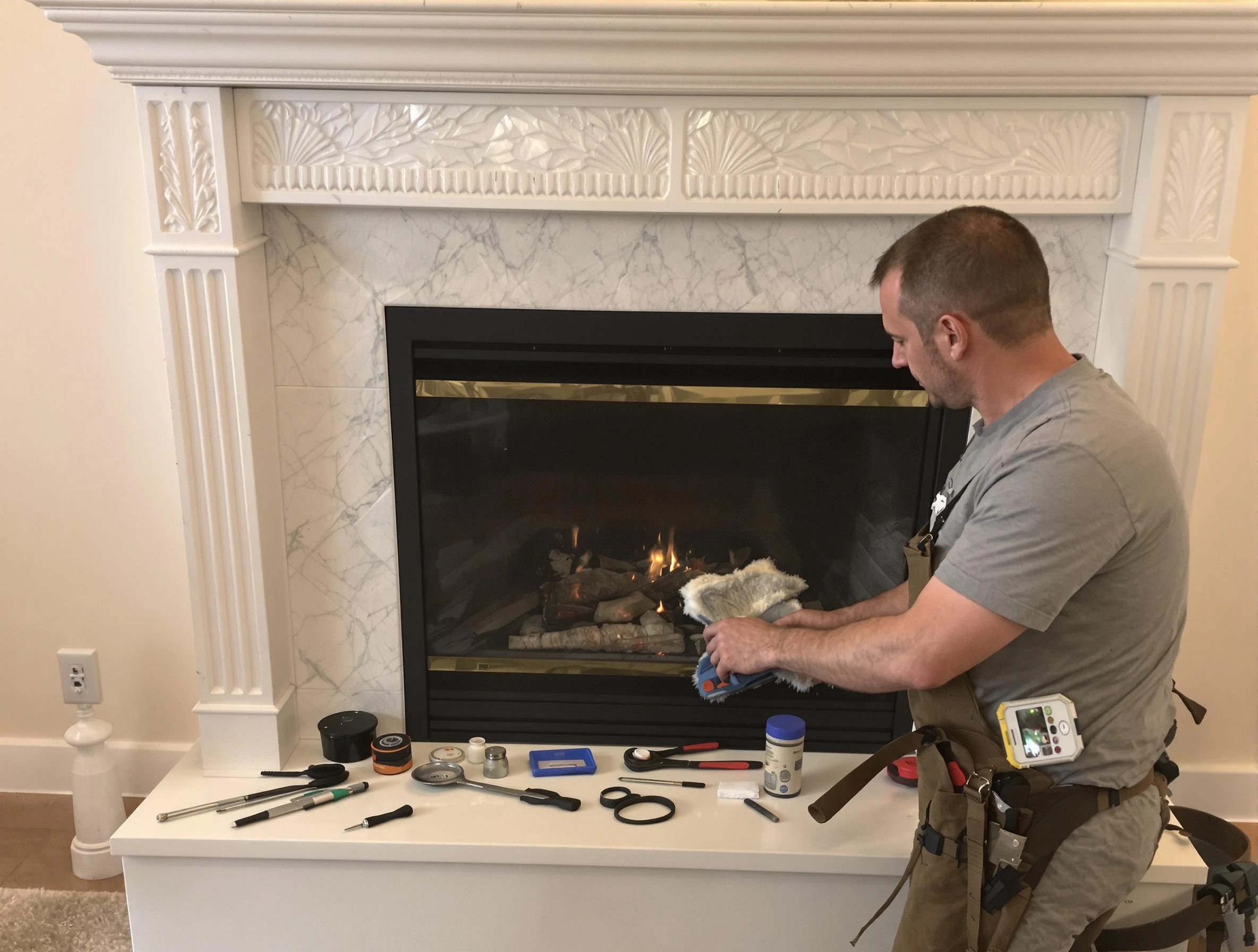 Woonsocket Chimney Sweep performing fireplace maintenance in Woonsocket, RI